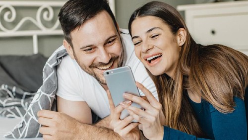 Young couple  lying in the bed early in the morning in bedroom