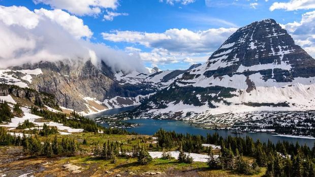 Panorama of a high mountain lake - Hidden Lake in the rocky mountains of Glacier National Park Montana. United states