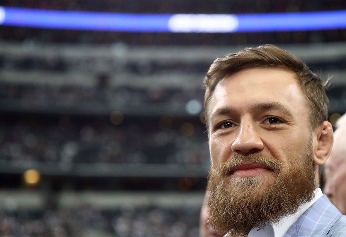 ARLINGTON, TX - OCTOBER 14:  Conor McGregor is seen on the sidelines before the NFL game between the Jacksonville Jaguars and Dallas Cowboys at AT&T Stadium on October 14, 2018 in Arlington, Texas.  (Photo by Ronald Martinez/Getty Images)
