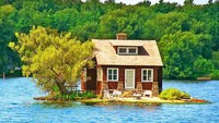 Dinamai Just Room Enough Island yang terletak di Kanada. Posisinya persis di tengah-tengah sungai Saint Lawrence. Ketika air pasang tinggi, sebagian rumah ikut terendam. Istimewa/Earthporm.