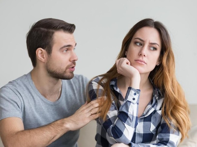 Couples are angry with love issues. Not understanding each other in family problems or infidelity . Couple having argument on the couch at home in the living room