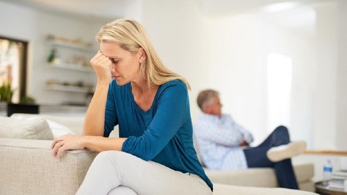 Couples are angry with love issues. Not understanding each other in family problems or infidelity . Couple having argument on the couch at home in the living room