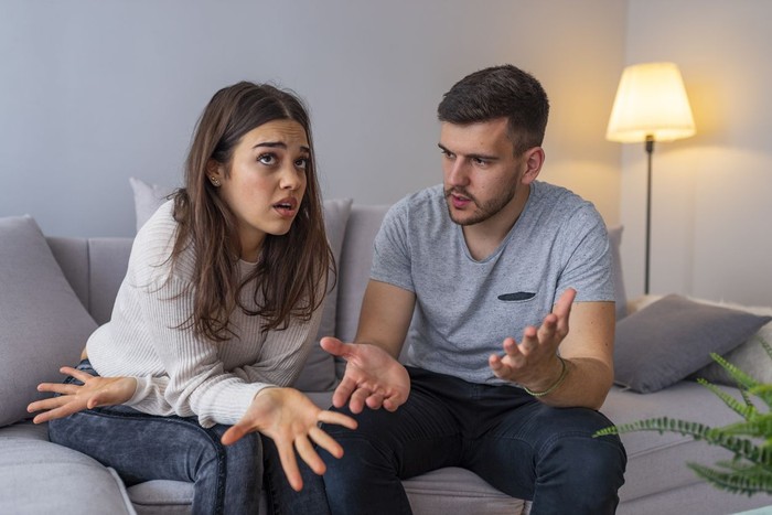 zodiak Couples are angry with love issues. Not understanding each other in family problems or infidelity . Couple having argument on the couch at home in the living room