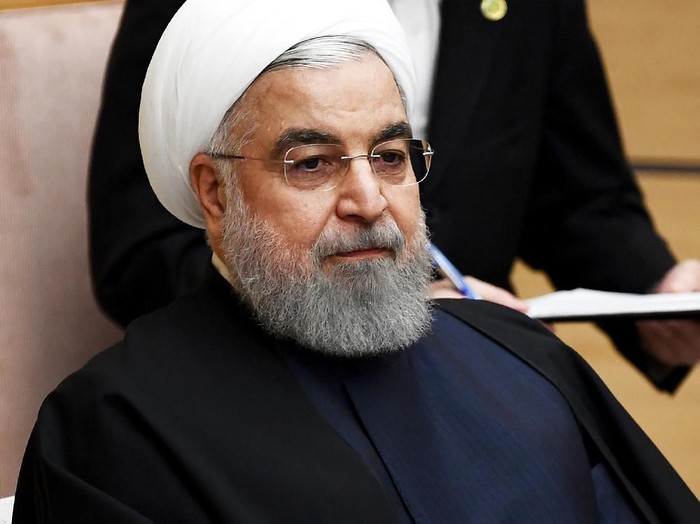 FILE - In this Dec. 20, 2019, file photo, Iranian President Hassan Rouhani attends a meeting with Japanese Prime Minister Shinzo Abe during a meeting at the prime ministers office in Tokyo.  Iran on Saturday, Jan. 11, 2020, acknowledged that its armed forces â€œunintentionallyâ€ shot down the Ukrainian jetliner that crashed earlier this week, killing all 176 aboard, after the government had repeatedly denied Western accusations that it was responsible. (Charly Triballeau/Pool Photo via AP, File)