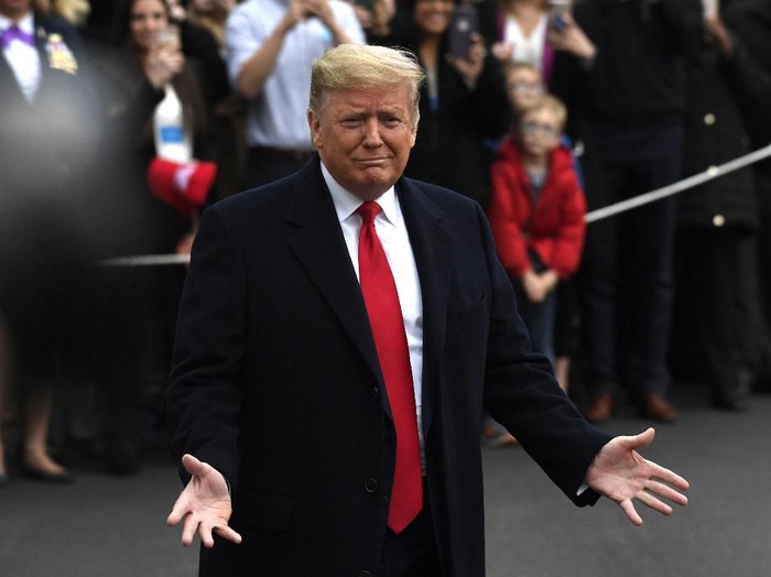 President Donald Trump speaks to the members of the media before leaving the White House, Monday, Jan. 13, 2020, in Washington, for a trip to watch the College Football Playoff national championship game in New Orleans. (AP Photo/Susan Walsh)