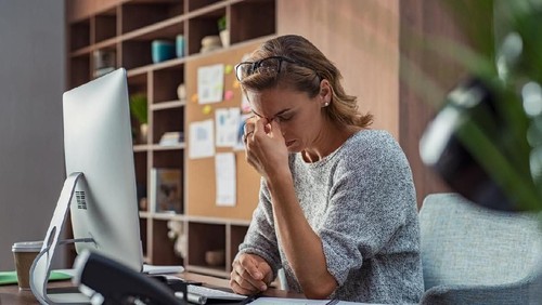 Confident couple trying to manage domestic finances, calculating and making notes