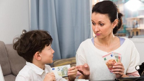 Confident couple trying to manage domestic finances, calculating and making notes