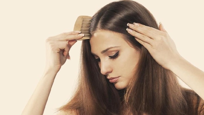 Ilustrasi rambut tebal Young brunette lady combing her beautiful long hair. isolated white