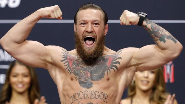 LAS VEGAS, NEVADA - JANUARY 17: Welterweight fighter Conor McGregor poses on the scale during a ceremonial weigh-in for UFC 246 at Park Theater at Park MGM on January 17, 2020 in Las Vegas, Nevada. McGregor will face Donald Cerrone at UFC 246 on January 18 in Las Vegas.   Steve Marcus/Getty Images/AFP