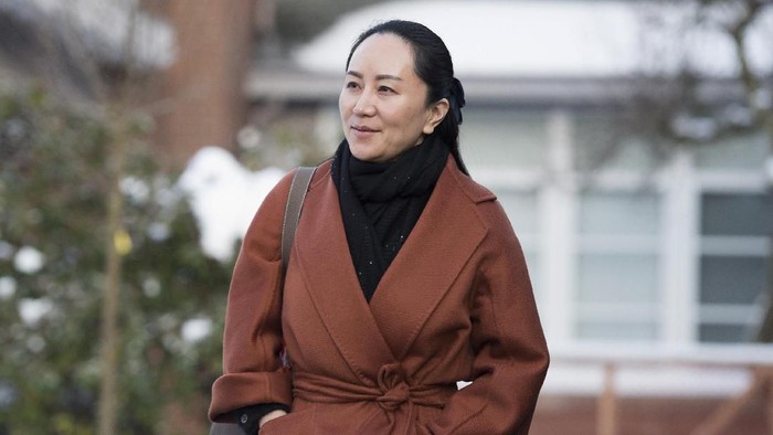FILE - In this  Jan. 17, 2020, file photo, Huawei chief financial officer Meng Wanzhou, who is out on bail and remains under partial house arrest after she was detained last year at the behest of American authorities, leaves her home in Vancouver, British Columbia, as she heads to B.C. Supreme Court for a case management hearing. The first stage of her extradition hearing begins Monday, Jan. 20, 2020, in a Vancouver courtroom, a case that has infuriated Beijing, set off a diplomatic furor and raised fears of a brewing tech war between China and the United States. (Jonathan Hayward/The Canadian Press via AP, File)