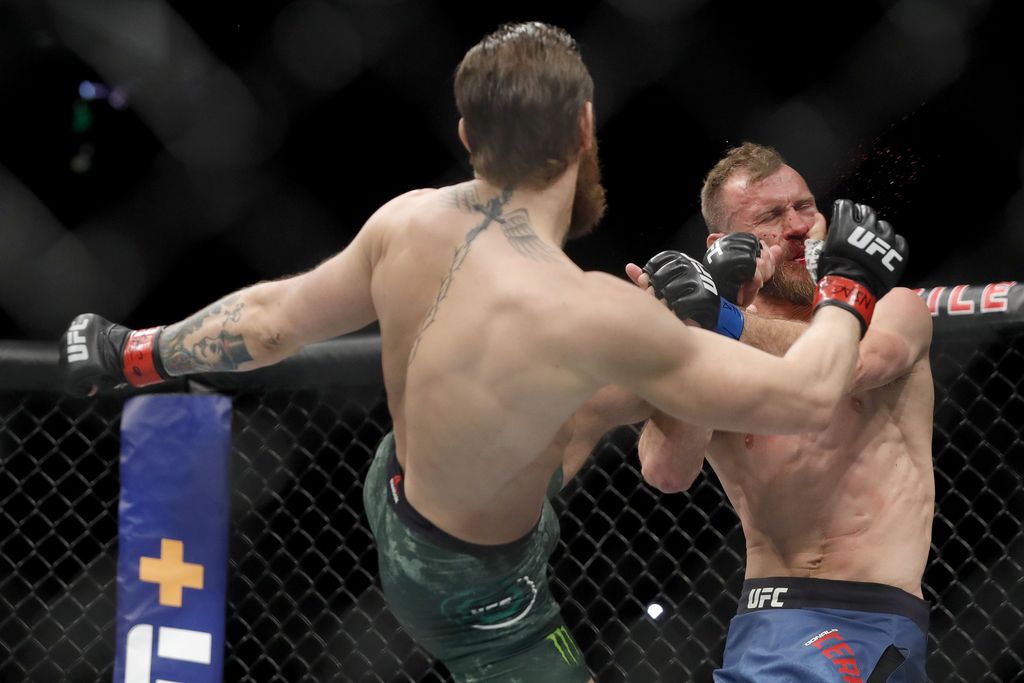 LAS VEGAS, NEVADA - JANUARY 18:  Conor McGregor lands a kick to the face of Donald Cerrone in the first round in a welterweight bout during UFC246 at T-Mobile Arena on January 18, 2020 in Las Vegas, Nevada.  (Photo by Steve Marcus/Getty Images)