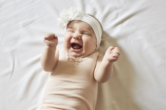 1161845453 Cute little baby girl laughing