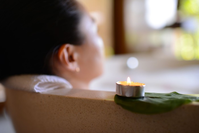 A beautiful woman enjoy and relaxing in hot tub.
