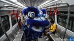 Barongsai Hibur Penumpang LRT Jakarta