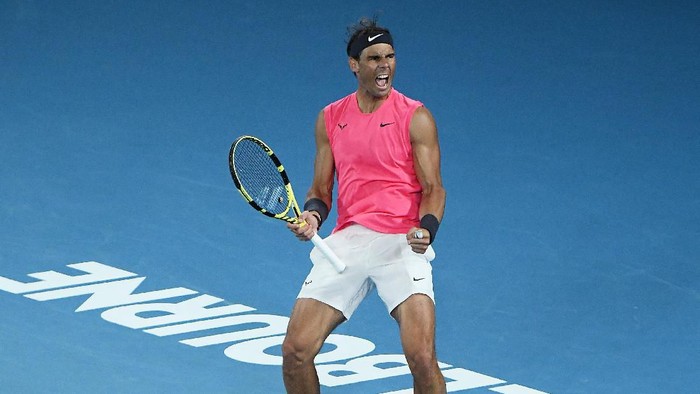 MELBOURNE, AUSTRALIA - JANUARY 27: Rafael Nadal of Spain celebrates after winning set point during his Mens Singles fourth round match against Nick Kyrgios of Australia on day eight of the 2020 Australian Open at Melbourne Park on January 27, 2020 in Melbourne, Australia. (Photo by Quinn Rooney/Getty Images)