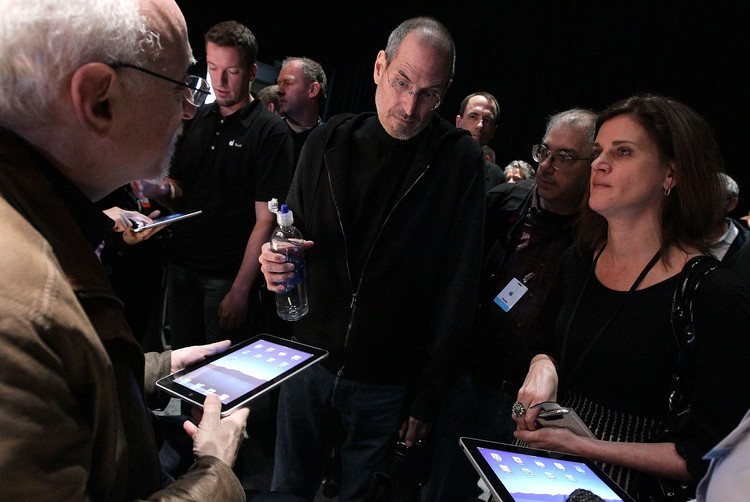 SAN FRANCISCO - JANUARY 27: Apple Inc. CEO Steve Jobs holds up the new iPad as he speaks during an Apple Special Event at Yerba Buena Center for the Arts January 27, 2010 in San Francisco, California. Apple introduced its latest creation, the iPad, a mobile tablet browsing device that is a cross between the iPhone and a MacBook laptop. (Photo by Justin Sullivan/Getty Images)