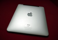 LONDON, ENGLAND - FEBRUARY 17:  In this photo illustration, a man holds an Apple ipad tablet on February 17, 2011 in London, England. Apple sold two million ipads in the first two months of their launch in 2010. Worldwide iPad sales are expected to amount to 20 million in 2012.  (Photo Illustration by Peter Macdiarmid/Getty Images)