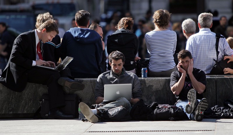 NEW YORK - APRIL 02:  People wait in line (facing camera) outside the flagship Apple store on Fifth Avenue in Manhattan to purchase the iPad when it debuts tomorrow morning April 2, 2010 in New York City. Around ten people were already waiting in line Friday afternoon ahead of Saturday's release of the much-anticipated tablet computer.  (Photo by Mario Tama/Getty Images)