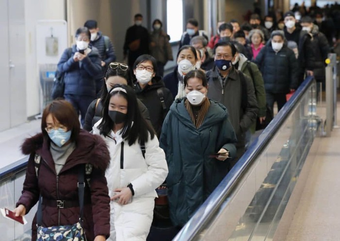 Passengers arriving from the Chinese city of Wuhan arrive at Narita Airport in Chiba, Japan in this photo taken by Kyodo January 23, 2020. Mandatory credit Kyodo/via REUTERS ATTENTION EDITORS - THIS IMAGE WAS PROVIDED BY A THIRD PARTY. MANDATORY CREDIT. JAPAN OUT. NO COMMERCIAL OR EDITORIAL SALES IN JAPAN