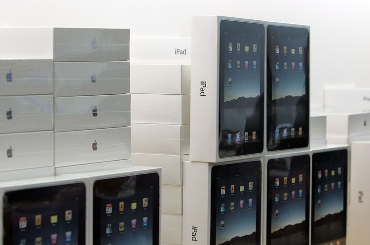 SAN FRANCISCO - APRIL 03:  Apple customer Andres Schobel holds up his two new iPads at an Apple store April 3, 2010 in San Francisco, California. Hundreds of people lined up hours before the Apple store opened to purchase the new iPad which debuted today.  (Photo by Justin Sullivan/Getty Images)