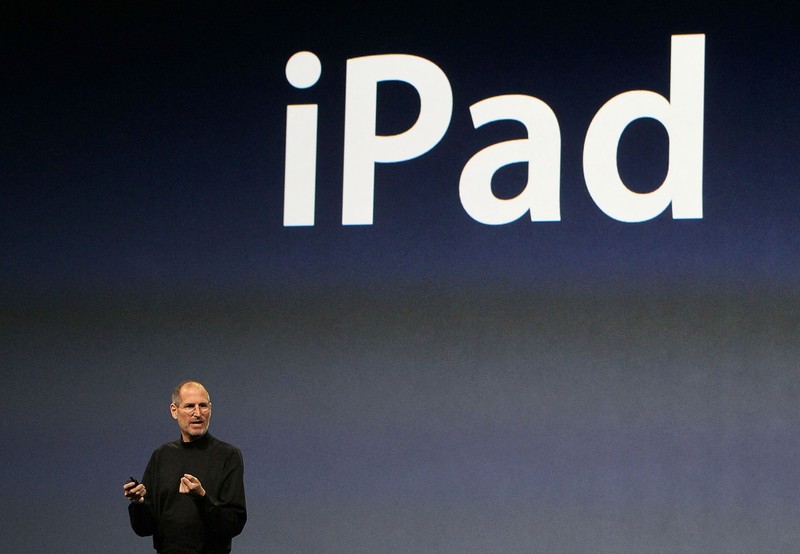 SAN FRANCISCO - JANUARY 27: Apple Inc. CEO Steve Jobs holds up the new iPad as he speaks during an Apple Special Event at Yerba Buena Center for the Arts January 27, 2010 in San Francisco, California. Apple introduced its latest creation, the iPad, a mobile tablet browsing device that is a cross between the iPhone and a MacBook laptop. (Photo by Justin Sullivan/Getty Images)