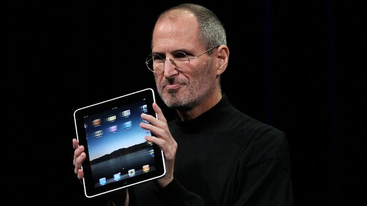SAN FRANCISCO - JANUARY 27: Apple Inc. CEO Steve Jobs holds up the new iPad as he speaks during an Apple Special Event at Yerba Buena Center for the Arts January 27, 2010 in San Francisco, California. Apple introduced its latest creation, the iPad, a mobile tablet browsing device that is a cross between the iPhone and a MacBook laptop. (Photo by Justin Sullivan/Getty Images)
