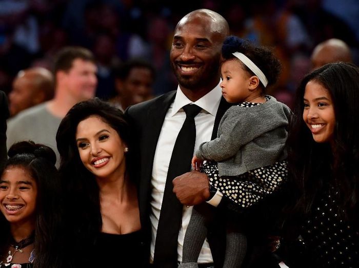 Kobe Bryant-Gianna SAN DIEGO, CA - APRIL 10: NBA Los Angeles Laker Kobe Bryant stands on the sideline with his daughter Gianna Maria-Onore Bryant on his shoulders prior to the start of the game against the United States and China during an international firendly match at Qualcomm Stadium on April 10, 2014 in San Diego, California. Kent C. Horner/Getty Images/AFP