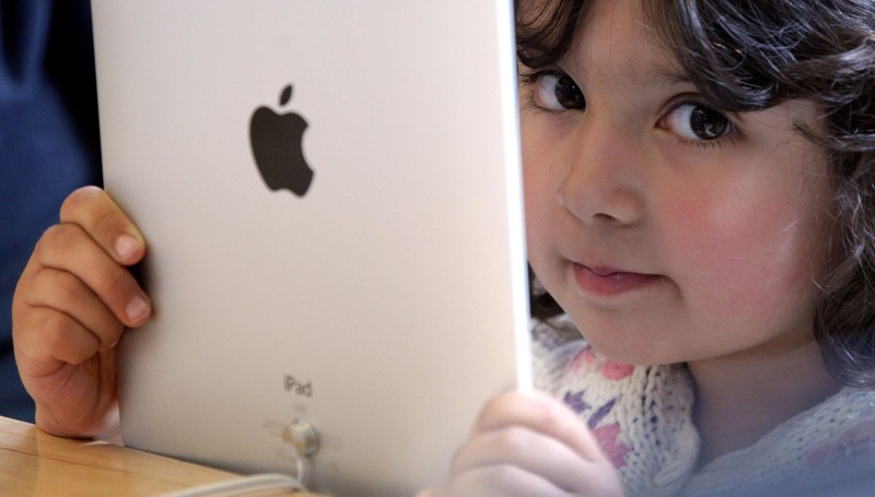 LONDON, ENGLAND - MAY 28:  A young girl holds an Apple iPad on display at Regent Street's Apple store on May 28, 2010 in London, England. Apple iPads went on sale today in countries including Japan, Australia, Germany, Italy, Canada, Switzerland and the United Kingdom as part of Apple's global roll-out of the hugely successful new device.  (Photo by Dan Kitwood/Getty Images)