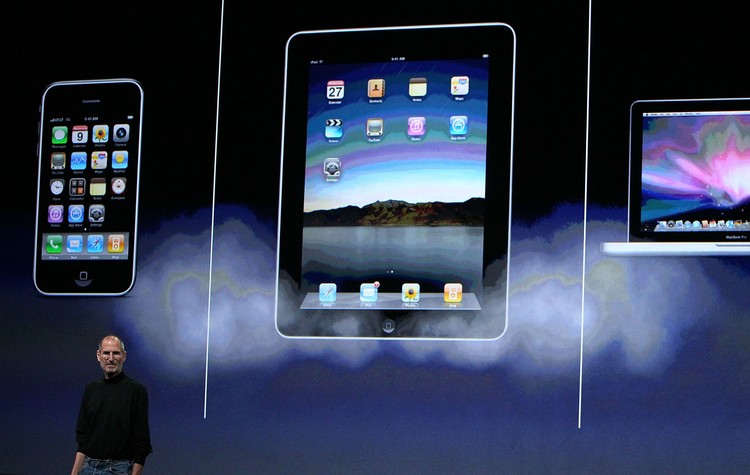 iPad SAN FRANCISCO - JANUARY 27: Apple Inc. CEO Steve Jobs holds up the new iPad as he speaks during an Apple Special Event at Yerba Buena Center for the Arts January 27, 2010 in San Francisco, California. Apple introduced its latest creation, the iPad, a mobile tablet browsing device that is a cross between the iPhone and a MacBook laptop. (Photo by Justin Sullivan/Getty Images)