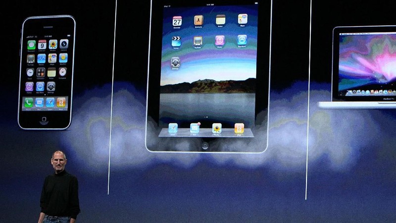 SAN FRANCISCO - JANUARY 27: Apple Inc. CEO Steve Jobs holds up the new iPad as he speaks during an Apple Special Event at Yerba Buena Center for the Arts January 27, 2010 in San Francisco, California. Apple introduced its latest creation, the iPad, a mobile tablet browsing device that is a cross between the iPhone and a MacBook laptop. (Photo by Justin Sullivan/Getty Images)