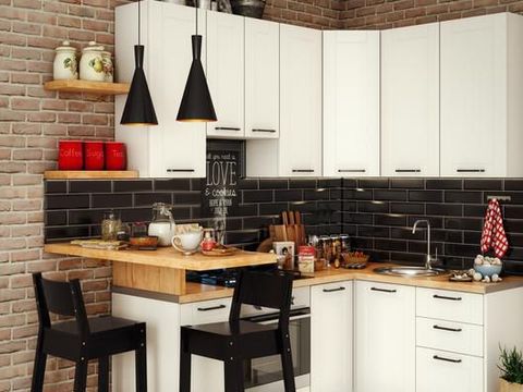 Scandinavian style kitchen with geometric backsplash and blue and white cupboards