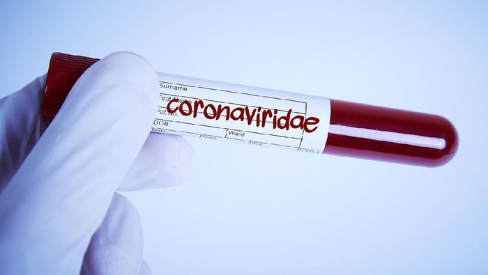 hoax Doctor Holding a Corona Blood sample in his hand