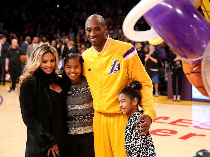 LOS ANGELES, CA - DECEMBER 19:  Kobe Bryant #24 of the Los Angeles Lakers poses with wife Vanessa and daughters Gianna (L) and Natalia during a ceremony honoring Bryant for moving into third place on the all time NBA scoring list and passing Michael Jordan, before the game withthe Oklahoma City Thunder at Staples Center on December 19, 2014 in Los Angeles, California.  NOTE TO USER: User expressly acknowledges and agrees that, by downloading and or using this photograph, User is consenting to the terms and conditions of the Getty Images License Agreement.  (Photo by Stephen Dunn/Getty Images)