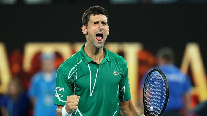 MELBOURNE, AUSTRALIA - JANUARY 30: Novak Djokovic of Serbia celebrates after winning his Mens Singles Semifinal match against Roger Federer of Switzerland on day eleven of the 2020 Australian Open at Melbourne Park on January 30, 2020 in Melbourne, Australia. (Photo by Clive Brunskill/Getty Images)