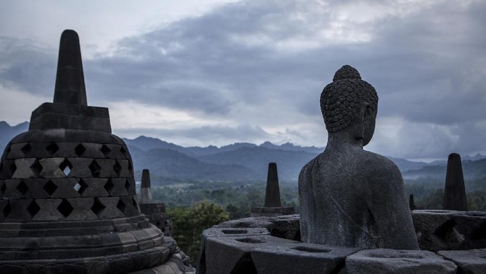 MAGELANG, CENTRAL JAVA, INDONESIA - MAY 10: Tourists at Borobudur temple during celebrations for Vesak Day on May 10, 2017 in Magelang, Central Java, Indonesia. Buddhists in Indonesia celebrate Vesak at the Borobudur temple annually, which makes it the most visited tourist attraction in Indonesia. It is observed during the full moon in May or June, with the ceremony centered at three Buddhist temples by walking from Mendut to Pawon and ending at Borobudur. The stages of life of Buddhisms founder, Gautama Buddha, which are celebrated at Vesak are his birth, enlightenment to Nirvana, and his passing (Parinirvana). (Photo by Ulet Ifansasti/Getty Images)