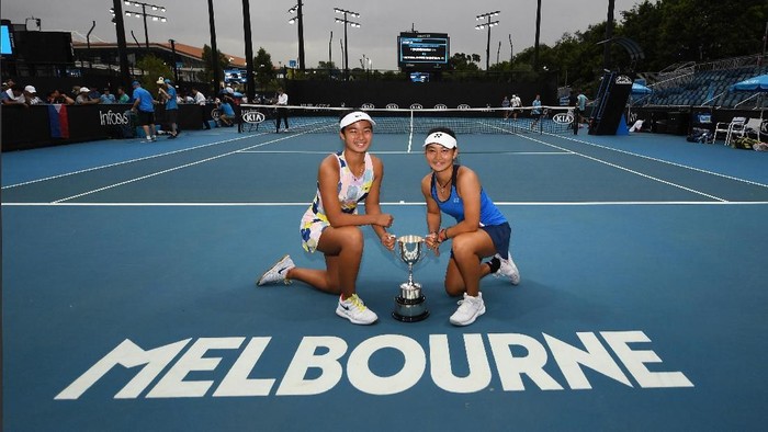 MELBOURNE, AUSTRALIA - JANUARY 31: Alexandra Eala of the Philippines and Priska Madelyn Nugroho of Indonesia pose with the championship trophy after winning their Junior Girls DoublesÂ Final against Ziva Falkner of Slovenia and Matilda Mutavdzic of Great Britain on day twelve of the 2020 Australian Open at Melbourne Park on January 31, 2020 in Melbourne, Australia. (Photo by Morgan Hancock/Getty Images)