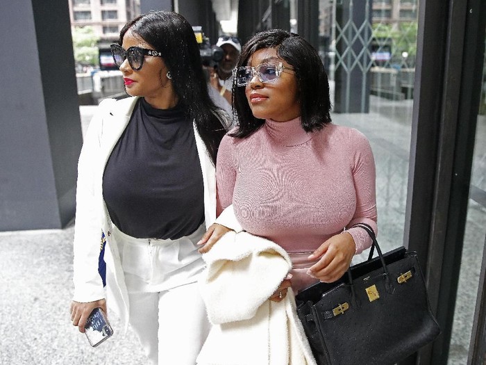 CHICAGO, ILLINOIS - JULY 16: Supporters of singer R. Kelly, (R-L) Azriel Clary and Joycelyn Savage, leave after the singers arraignment at the Dirksen Federal Building on July 16, 2019 in Chicago, Illinois. (Photo by Nuccio DiNuzzo/Getty Images)