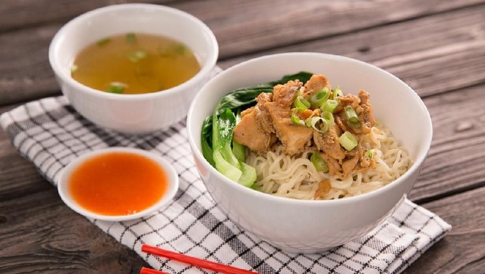 mie or bakmi ayam. seasoned yellow wheat noodles topped with diced chicken meat