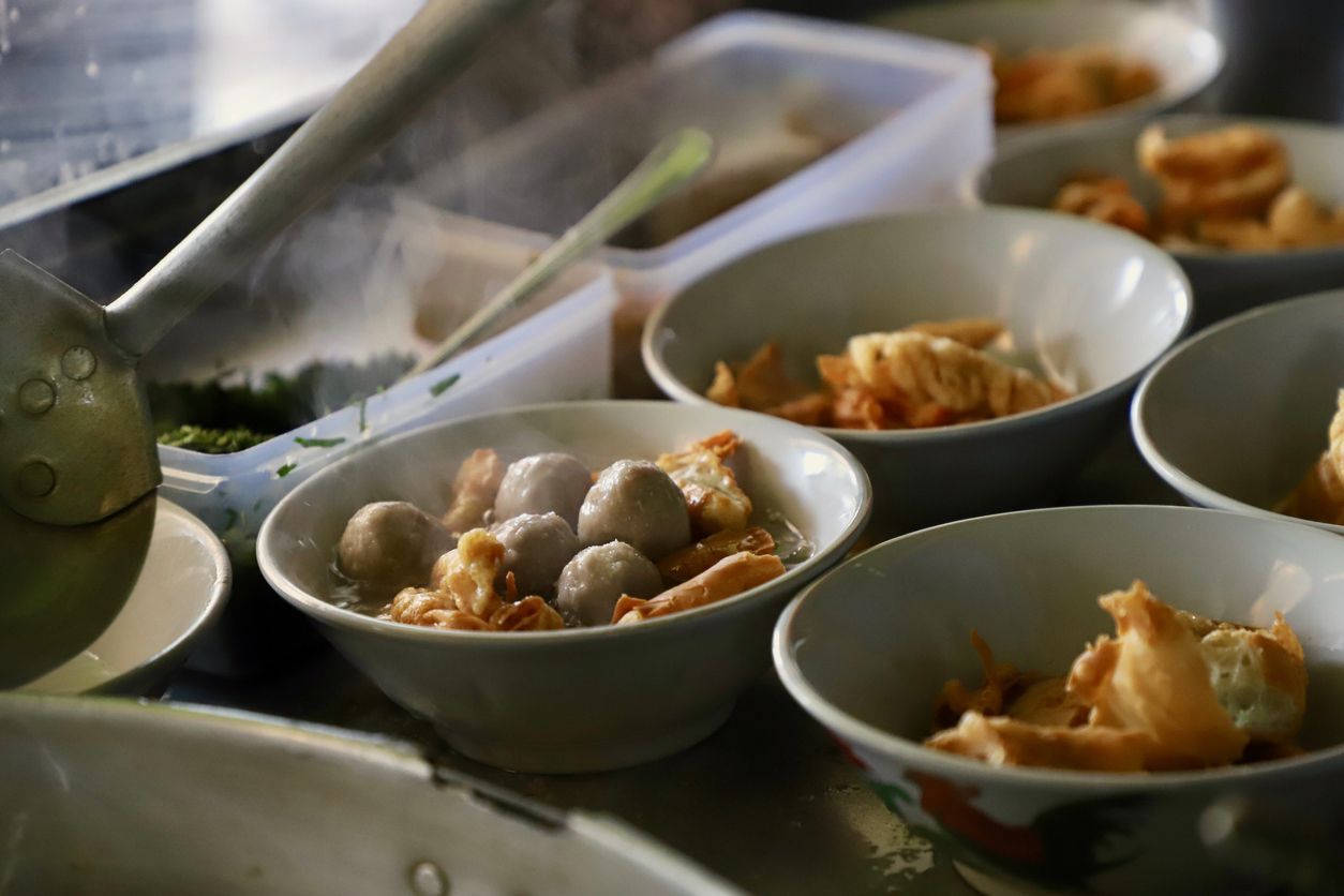 Bakso Cuanki, a Sundanese street food dish of fried wonton dumplings and meatballs in hot beef broth.