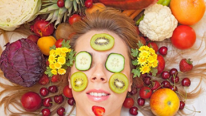 505283675 Female face with lot of fruit and vegetables