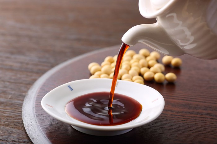 Soy been on spoon it on white table background with copy space,healthy concept.