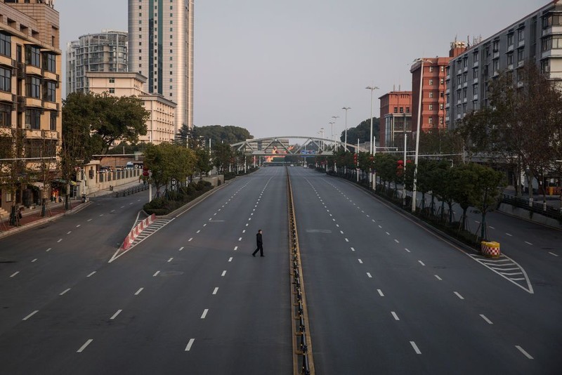 WUHAN, CHINA - FEBRUARY 03:  (CHINA OUT) A person wears a protective mask as he walks down an empty street on February 3, 2020 in Wuhan, Hubei province, China. The number of those who have died from the Wuhan coronavirus, known as 2019-nCoV, in China climbed to 361 and cases have been reported in other countries including the United States, Canada, Australia, Japan, South Korea, India, the United Kingdom, Germany, France, and several others.  (Photo by Getty Images)