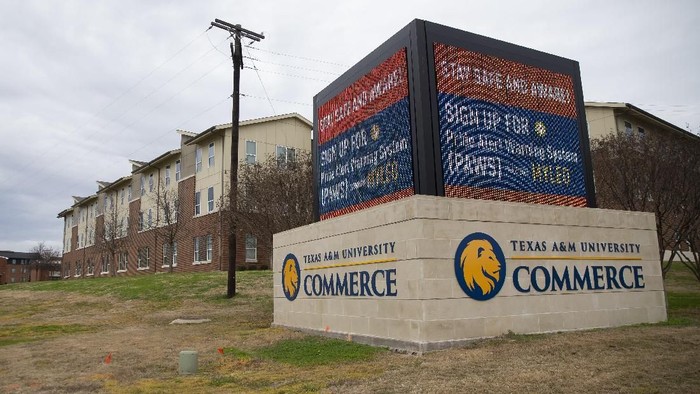 A sign outside of Pride Rock residence hall warns students following a shooting, Monday, Feb. 3, 2020, at Texas A&M University-Commerce in Commerce, Texas. (Juan Figueroa/The Dallas Morning News via AP)