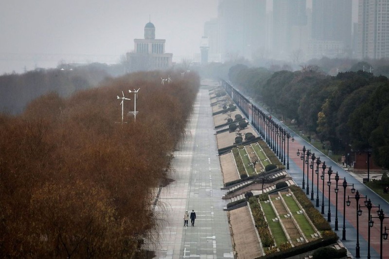 WUHAN, CHINA - JANUARY 31:  (CHINA OUT) A man wears a protective mask as he ride a bicycle across the Yangtze River Bridge on January 31, 2020 in Wuhan, China.  World Health Organization (WHO) Director-General Tedros Adhanom Ghebreyesus said on January 30 that the novel coronavirus outbreak has become a Public Health Emergency of International Concern (PHEIC).  (Photo by Stringer/Getty Images)