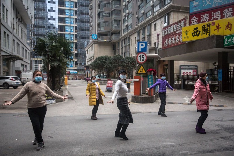 WUHAN, CHINA - JANUARY 31:  (CHINA OUT) A man wears a protective mask as he ride a bicycle across the Yangtze River Bridge on January 31, 2020 in Wuhan, China.  World Health Organization (WHO) Director-General Tedros Adhanom Ghebreyesus said on January 30 that the novel coronavirus outbreak has become a Public Health Emergency of International Concern (PHEIC).  (Photo by Stringer/Getty Images)