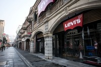 WUHAN, CHINA - FEBRUARY 03:  (CHINA OUT) A person wears a protective mask as he walks down an empty street on February 3, 2020 in Wuhan, Hubei province, China. The number of those who have died from the Wuhan coronavirus, known as 2019-nCoV, in China climbed to 361 and cases have been reported in other countries including the United States, Canada, Australia, Japan, South Korea, India, the United Kingdom, Germany, France, and several others.  (Photo by Getty Images)