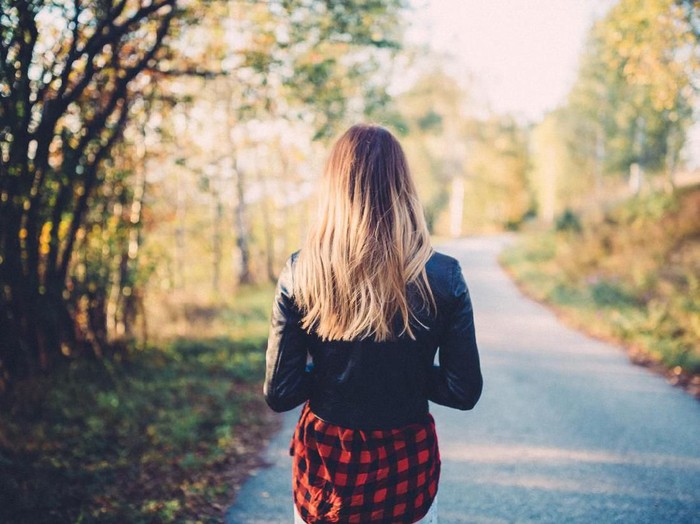 Rear view of woman on a leisure walk among nature