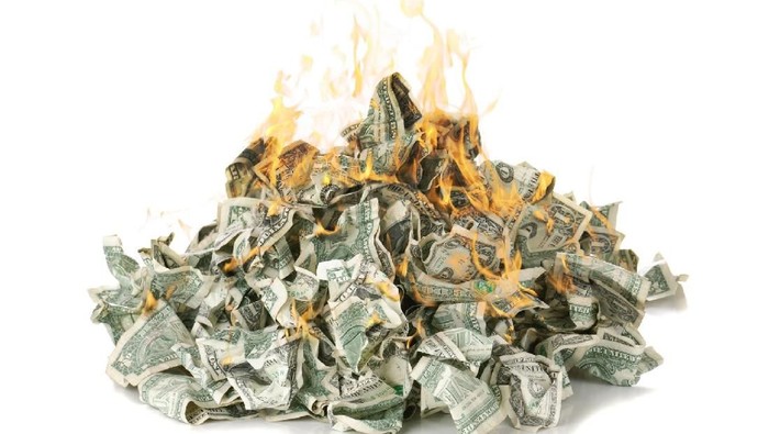 A stock photo of 100 dollars on fire. Please note the money is not real and is marked for motion picture use only