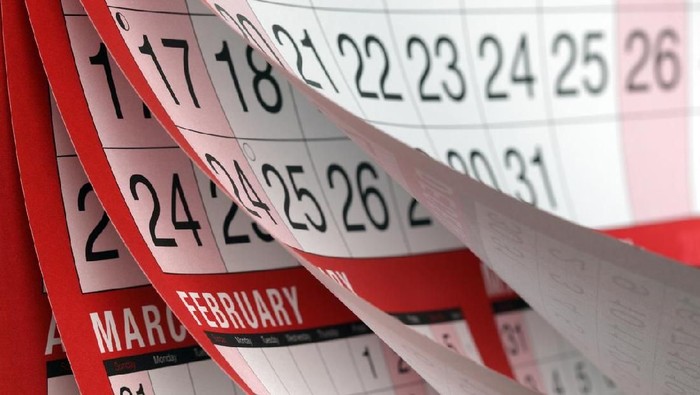 Months and dates shown on a calendar whilst turning the pages