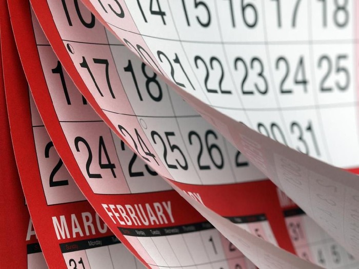 Months and dates shown on a calendar whilst turning the pages